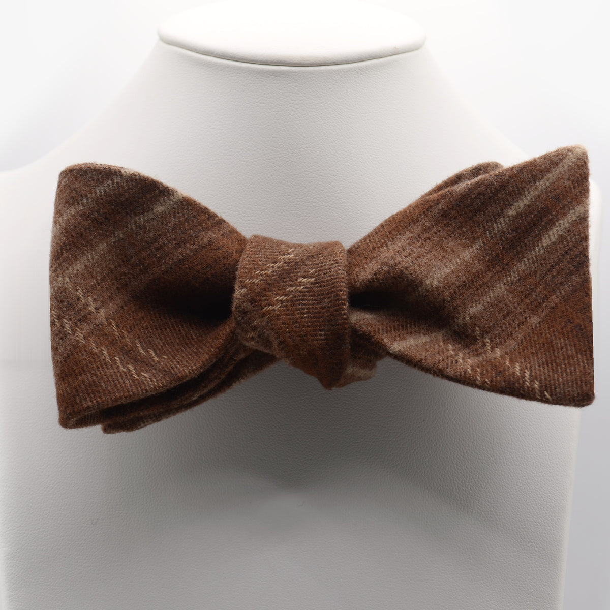 Brown Textured Stripe Bow Tie shown on a white display stand
