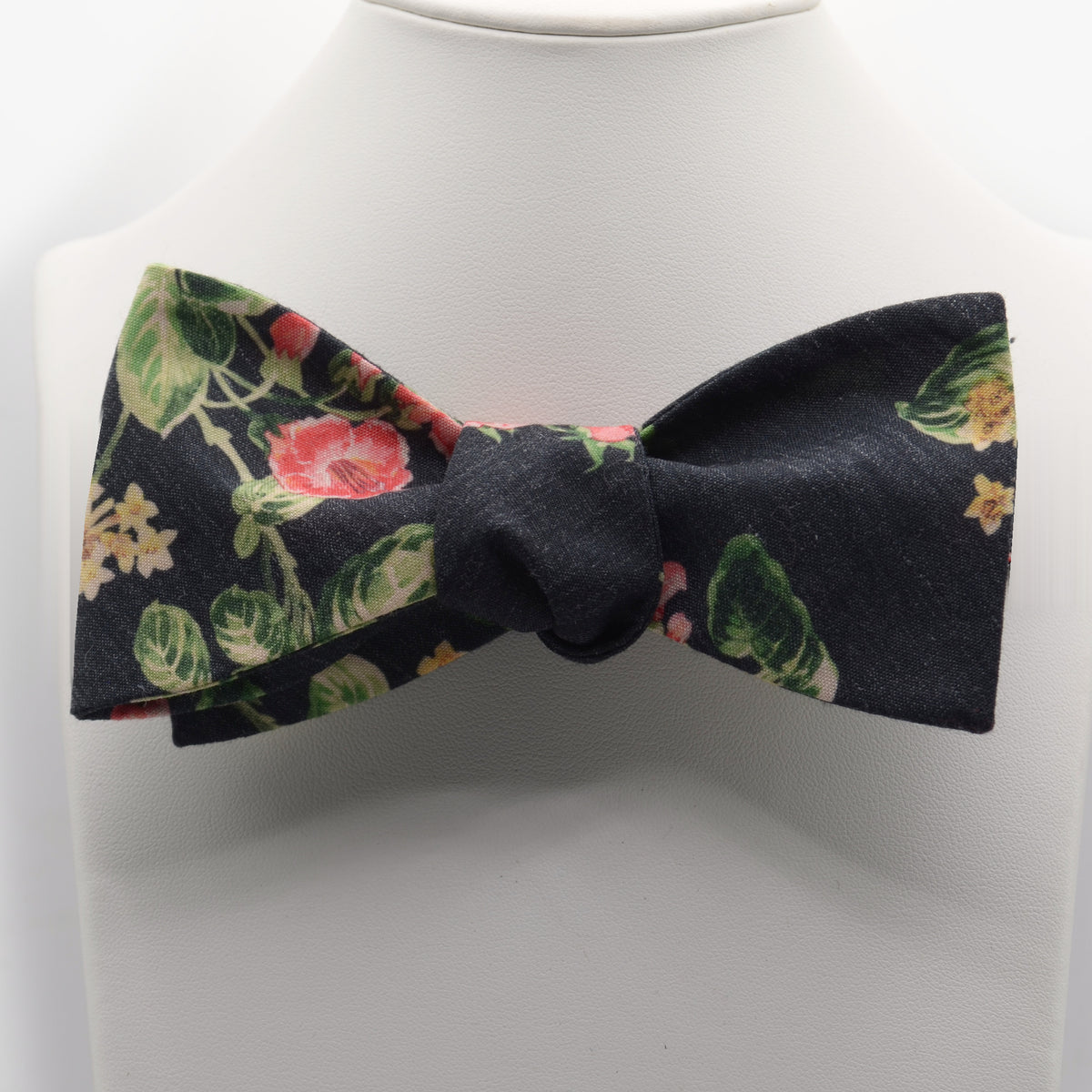 Blue plaid Ellis bow tie photographed on a white shirt