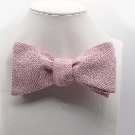 Dusty Pink Bow Tie shown on a white display stand