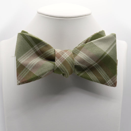 Olive and Tan Plaid Bow Tie shown on a white display stand
